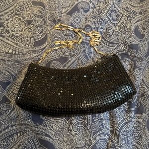 Crescent shaped black metallic purse